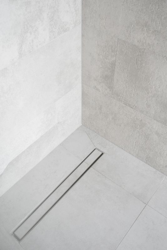 Sleek Linear Drain and Glass Enclosure